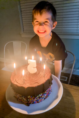 boy smiling with birthday cake