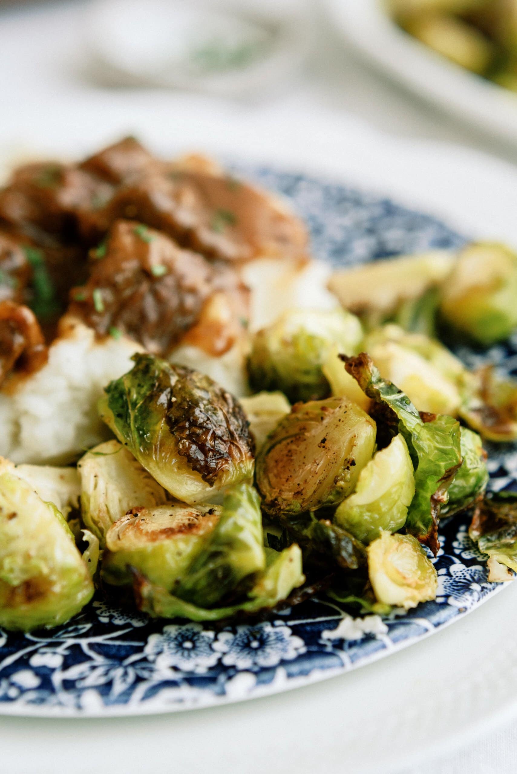 roasted brussel sprouts on a plate with other food