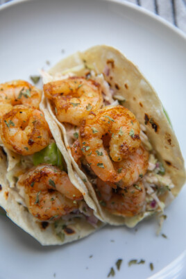 two shrimp tacos on plate